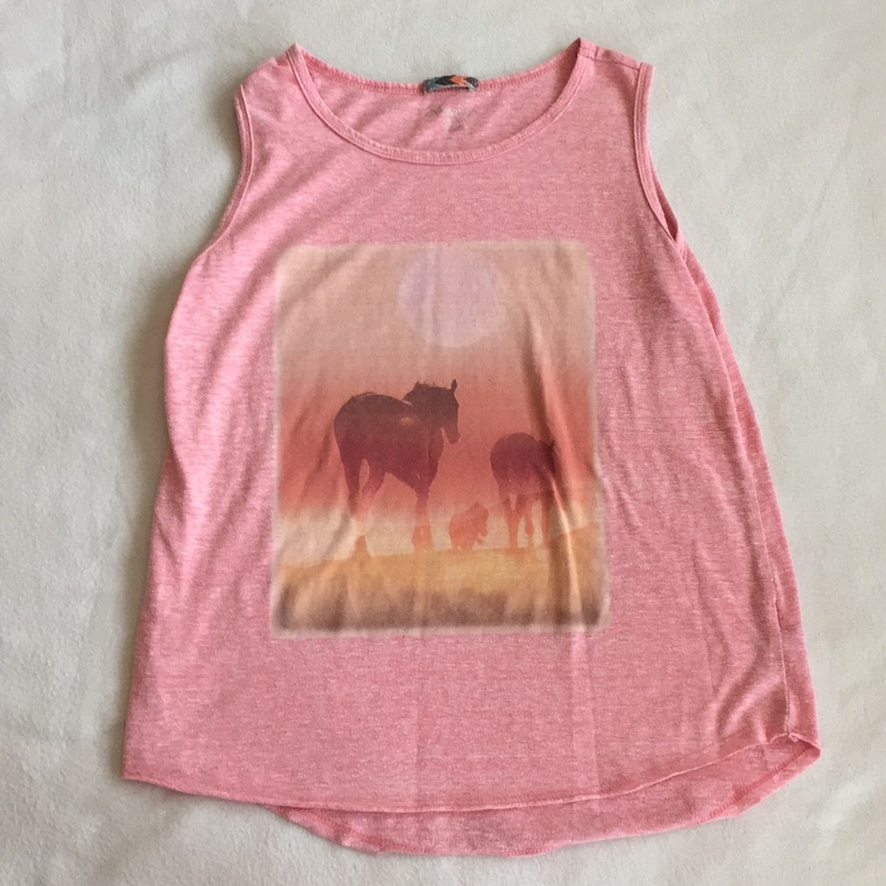 A pink tank with a design of horses